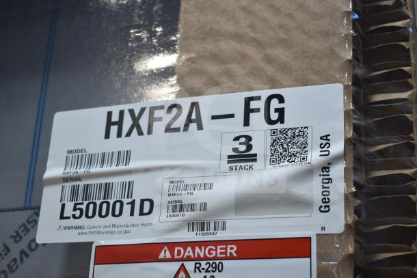 Label of Hoshizaki HXF2A-FG freezer, model details, serial number L50001D, safety warnings, and QR code visible.