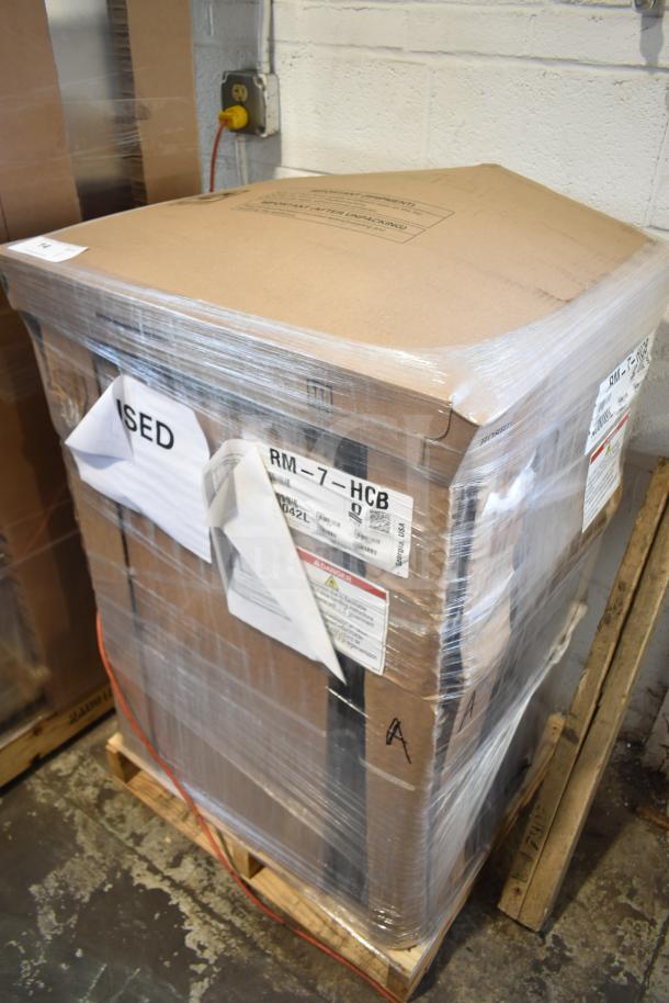 Brand new Hoshizaki RM-7-HCB 21" countertop refrigerator, packaged on a pallet. Scratch and dent condition noted.