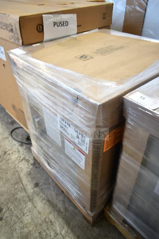 Brand new Hoshizaki UF27B-GLP01 27" undercounter freezer in packaging. Visible labels show model details.