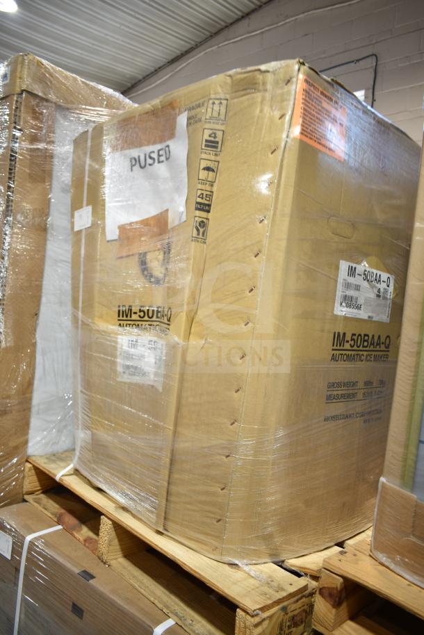 New boxed 2020 Hoshizaki IM-50BAA-Q ice sphere machine, 50 lbs/day, 115 volts, with visible packaging labels and markings.