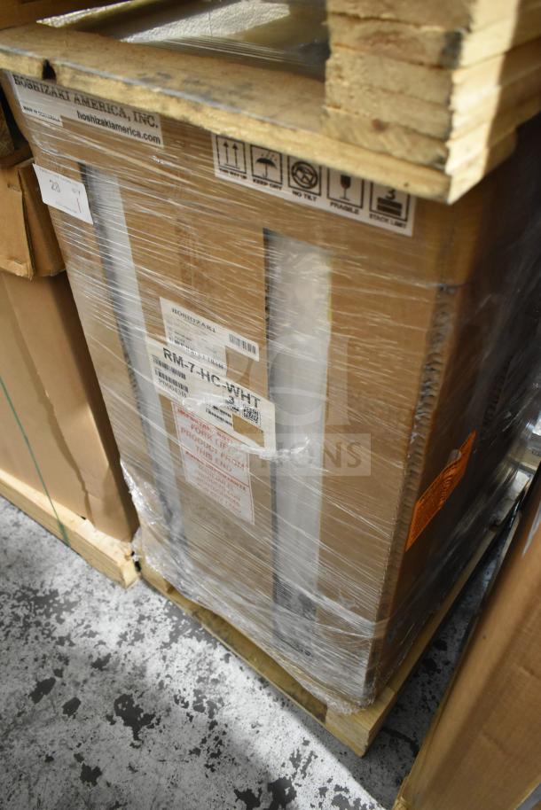 Brand new Hoshizaki RM-7-HC-WHT 21" countertop refrigerator in packaging. Features front access swing door, 115 volts, 1 phase.
