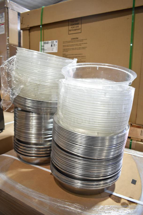 106 assorted dome covers featuring stainless steel and clear poly, stacked and wrapped, excellent condition.
