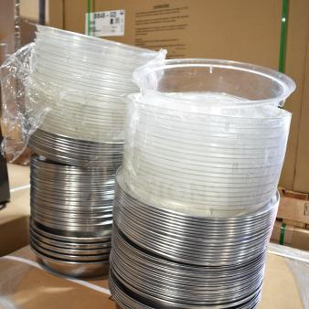106 assorted dome covers featuring stainless steel and clear poly, stacked and wrapped, excellent condition.