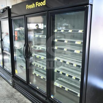 2021 True GDM-72-HC commercial 3-door cooler merchandiser, 115 volts, 1 phase, "Fresh Food" sign, excellent condition.