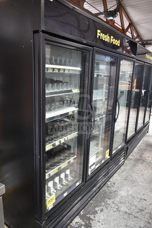 2020 True GDM-72-HC commercial 3-door reach-in cooler merchandiser, black finish, shelves with price tags, tested working.