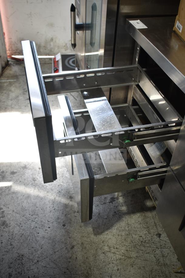 Everest ETBR2-D4 4 Drawer Undercounter Cooler on Casters; stainless steel, 115V, commercial use, drawers open.