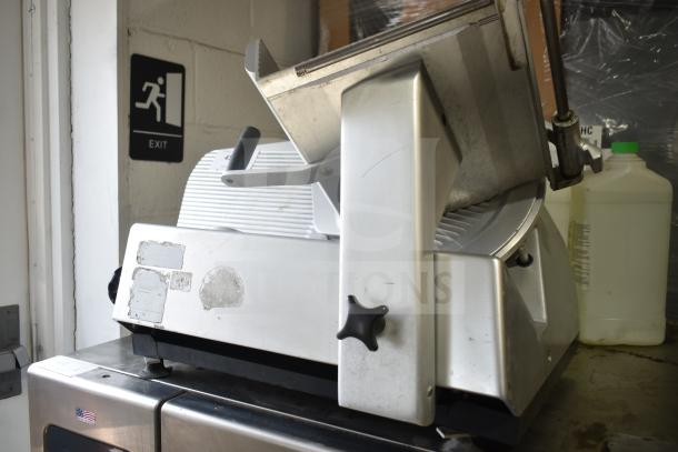 Bizerba SE12D commercial countertop meat slicer, stainless steel, 120 volts, 1 phase; visible wear marks.