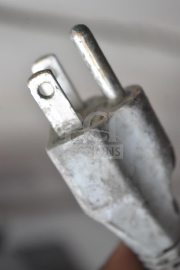 Close-up of an electrical plug for a Bizerba SE12D commercial meat slicer, 120 volts, 1 phase.