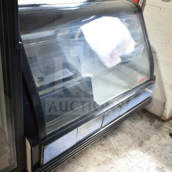 Torrey TEC130L-UL commercial floor deli display case, curved glass front, black trim, 127V, 1 Phase.