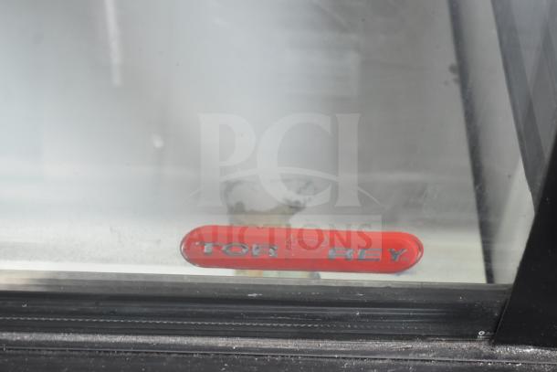 Torrey TEC130L-UL commercial deli display case, features Torrey red logo, 127 volts, 1 phase, clear glass panel.