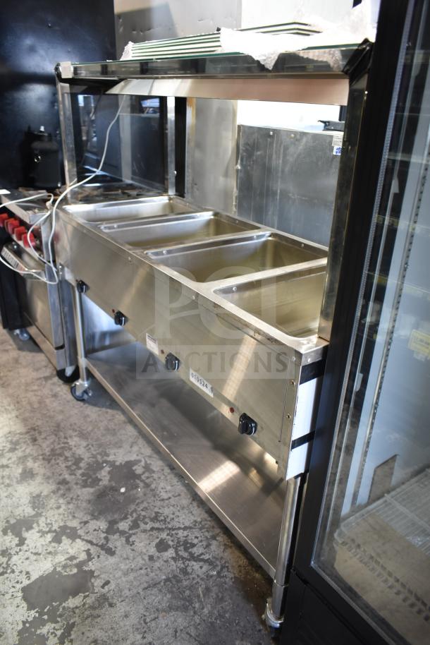 NH-4-240-SU electric 4-well steam table, 240 volts, stainless steel, excellent condition, labeled with model number.