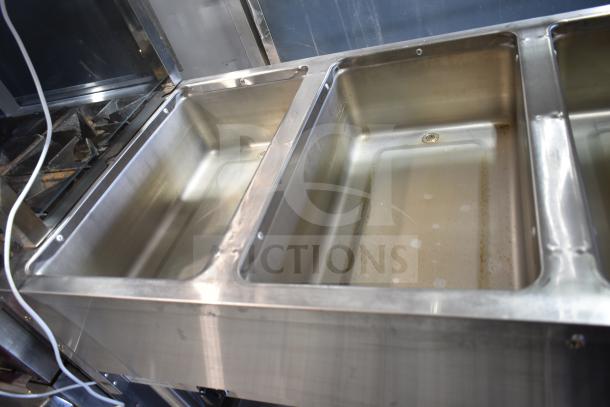 NH-4-240-SU electric steam table with 4 wells, 240 volts, stainless steel finish, in good condition.