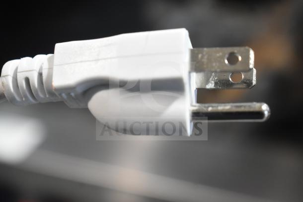 Close-up of a white electrical plug for NH-4-240-SU Commercial Electric 4 Well Steam Table, 240 Volts.