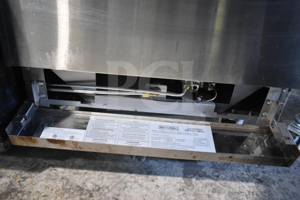 Precision commercial natural gas 4-burner range with oven, over shelf, backsplash, on casters; visible label details.