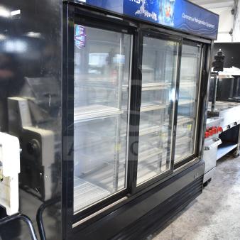 Dukers DSM-68SR 3-door commercial cooler, on casters, 115V, 1 phase. Well-maintained, features shelves and branding.