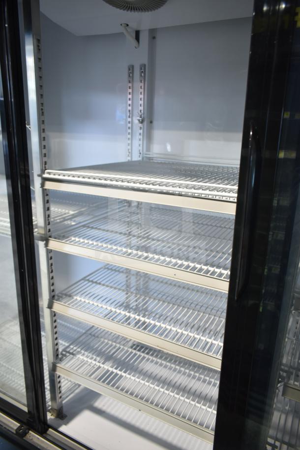 Dukers DSM-68SR commercial 3-door reach-in cooler with shelves, on casters, 115 volts, 1 phase, mint condition.