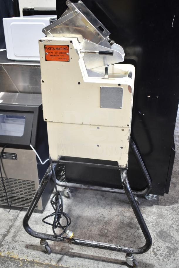 Pasta Mat commercial pasta machine on casters, 208 volts, cream color, metal parts, visible label with manufacturer's details.