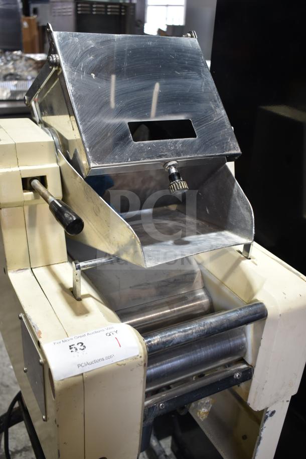 Pasta Mat commercial pasta machine on casters, 208 volts, stainless steel rollers, showing signs of use.