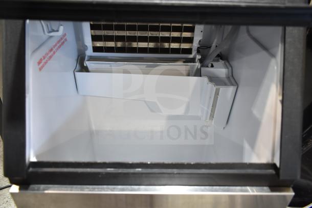 Cowsar HZB-45A ice maker interior, 100 lb/day capacity, 33 lb storage, clean condition, visible ice cube grid, 115V.