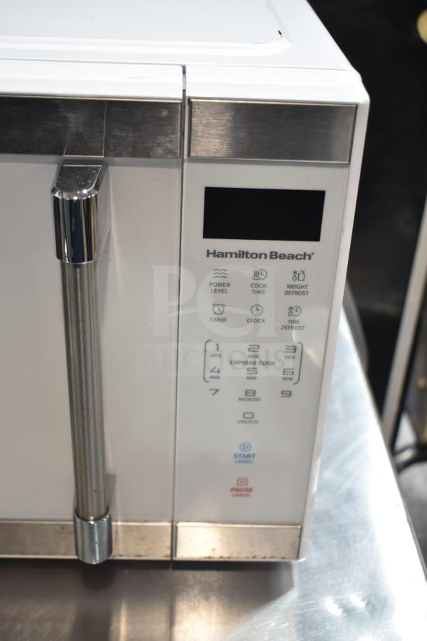 Hamilton Beach HB8436193153-02 countertop microwave oven, no plate, 120 volts, 1 phase, white exterior, control panel visible.
