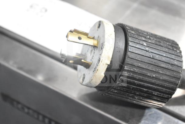 Hoshizaki KM-650MAH ice machine power plug, 208-230V, 1 phase; black and white details visible, slight wear.