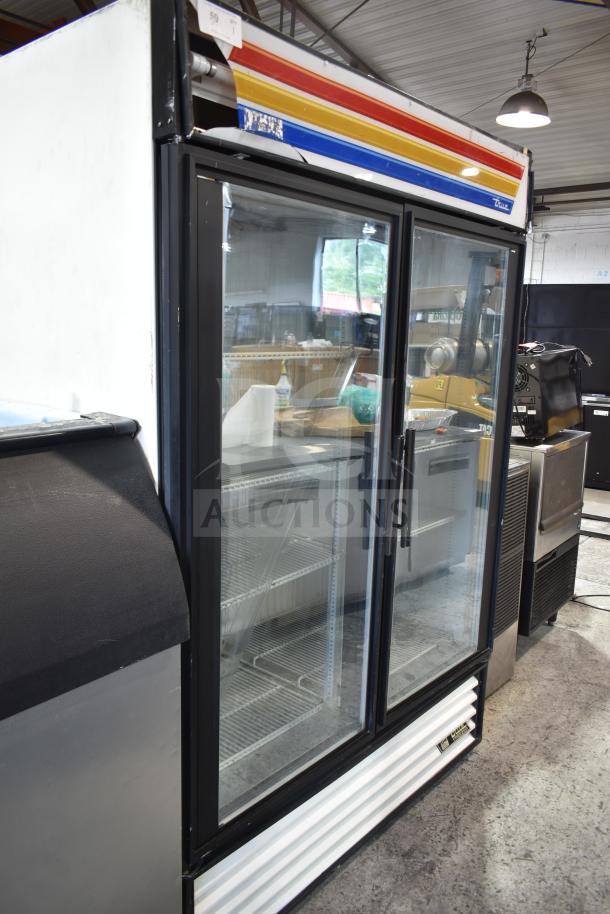 True GDM-49F commercial 2-door reach-in freezer merchandiser, with glass doors, 115/208-230 volts, 1 phase, good condition.