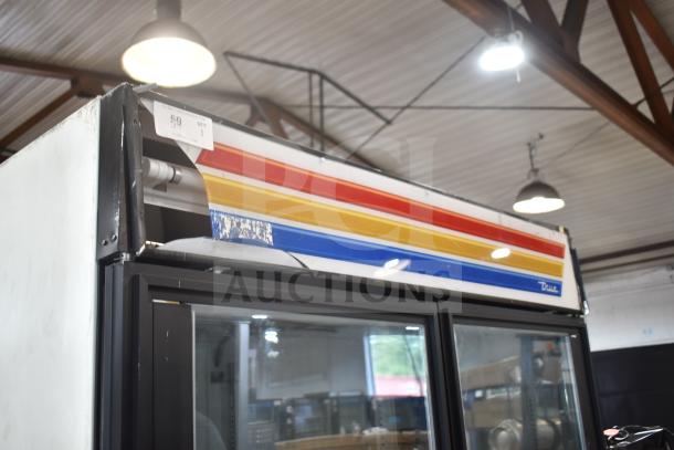 True GDM-49F Commercial 2 Door Reach-In Freezer Merchandiser in used condition, visible wear, 115/208-230V, single phase.