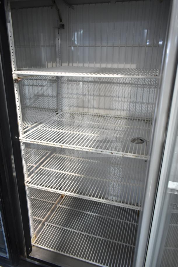 True GDM-49F 2 Door Reach In Freezer Merchandiser, clean interior, multiple shelves, 115/208-230V, 1 phase.