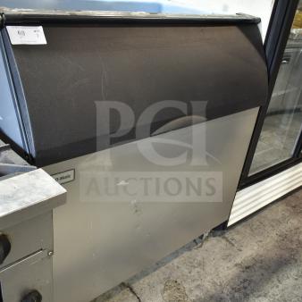 2019 Ice-O-Matic B110PS reinforced ice storage bin, 854 lb. capacity, visible surface wear, black and stainless finish.