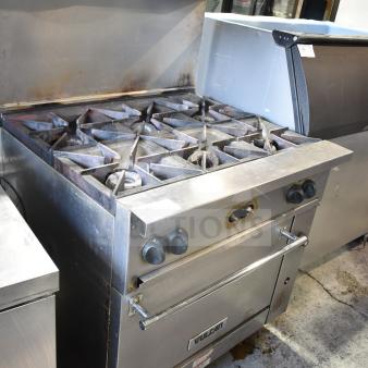 Vulcan 36S-6BN commercial gas range with 6 burners, oven, overshelf, backsplash, and casters. Used condition.
