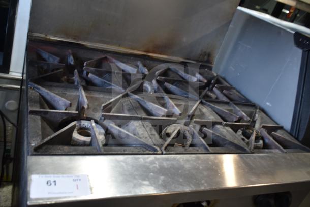 Vulcan 36S-6BN commercial gas 6-burner range with oven, overshelf, backsplash, on casters, used condition.