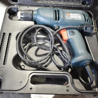 Black & Decker DR220 corded drill in hard case, 10mm, 120V, 1 phase, model DR220, with cord and ergonomic handle.
