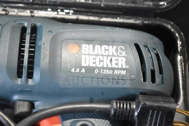 Black & Decker DR220 corded drill, 10mm, 4.5A, 0-1350 RPM, 120V, in hard case, visible branding and specifications.