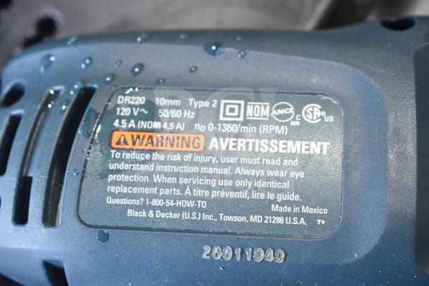 Black & Decker DR220 corded drill, 10mm, 120V, 4.5A, with warning label. Model info and specs visible.