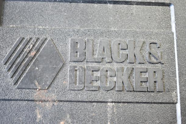 Black & Decker DR220 Corded Drill, 10mm, in hard case. 120 volts, 1 phase. Brand logo embossed on case cover.