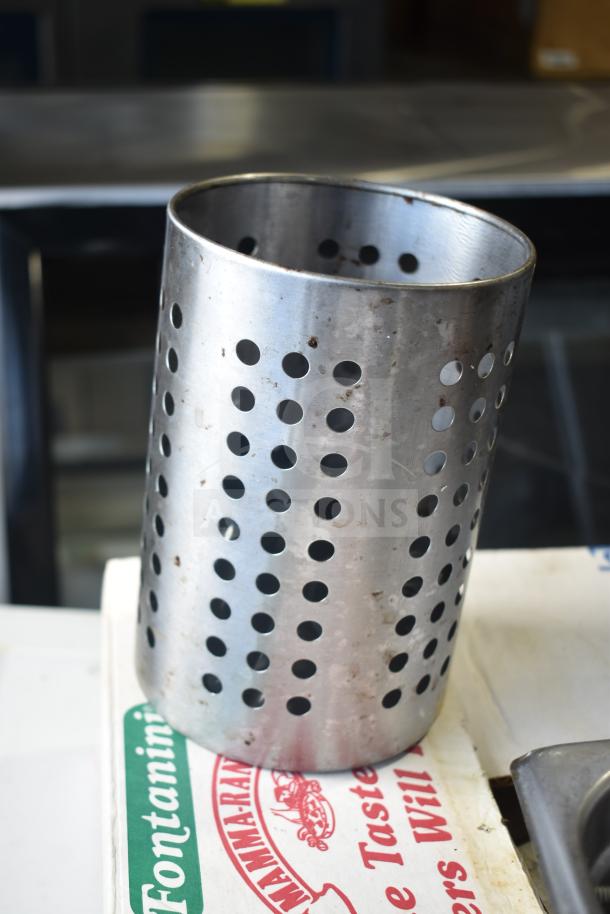 Metal utensil holder with perforated design, some wear visible, part of a miscellaneous auction lot.