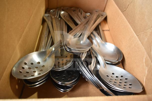 Box of stainless steel serving spoons, including slotted designs, in good condition. Part of a mixed lot auction.
