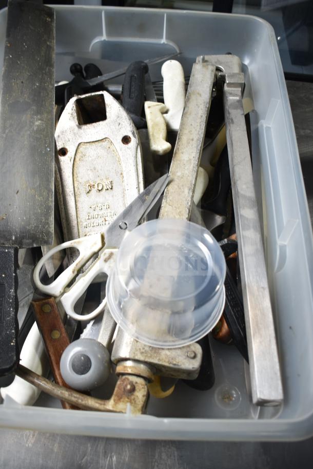 Assorted lot including serving spoons, a fire extinguisher, scissors, and a storage bin. Various conditions.