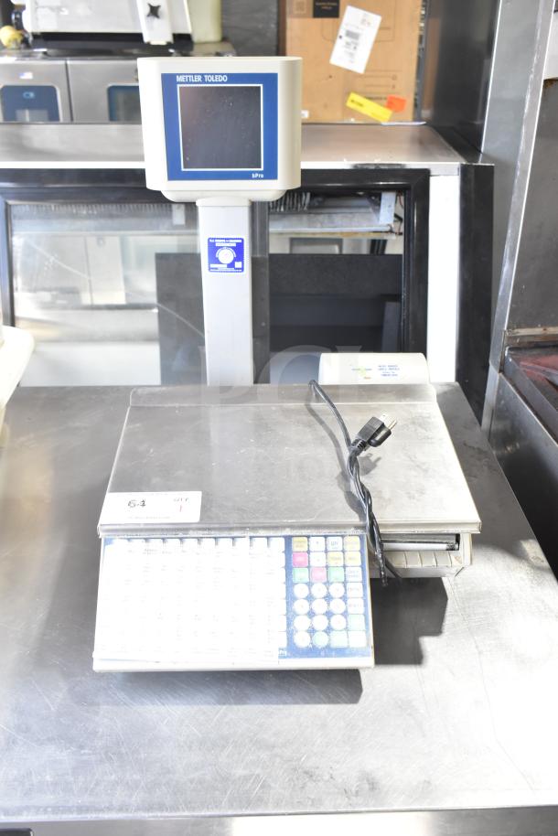 Mettler Toledo bPro commercial countertop food portioning scale, 100 volts, 1 phase, keypad, digital display, in good condition.