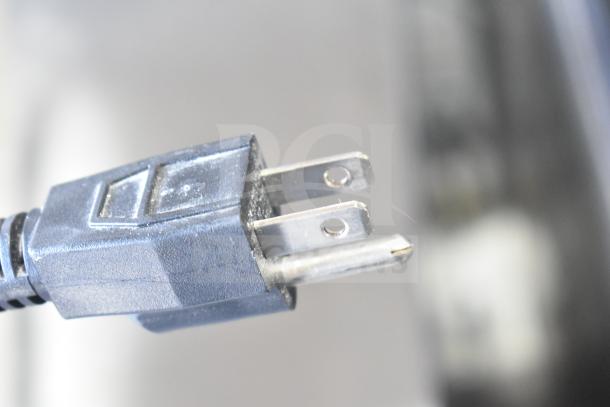 Mettler Toledo bPro commercial food portioning scale plug, 100 volts, 1 phase, close-up view.