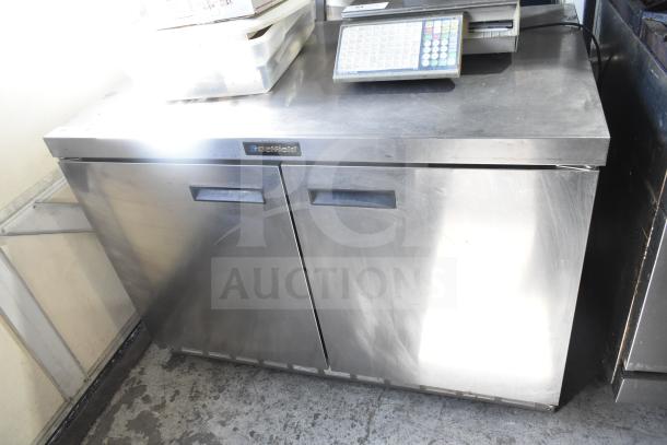Delfield 4448 commercial undercounter cooler, 2 doors, stainless steel, 115V, 1 phase, good condition, visible branding.