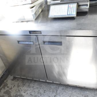 Delfield 4448 commercial undercounter cooler, 2 doors, stainless steel, 115V, 1 phase, good condition, visible branding.