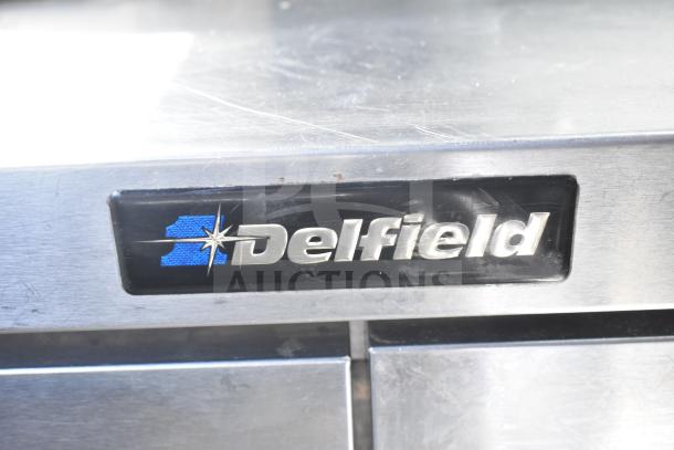 Delfield 4448 Commercial 2 Door Undercounter Cooler, 115V, features Delfield logo, stainless steel, good condition.