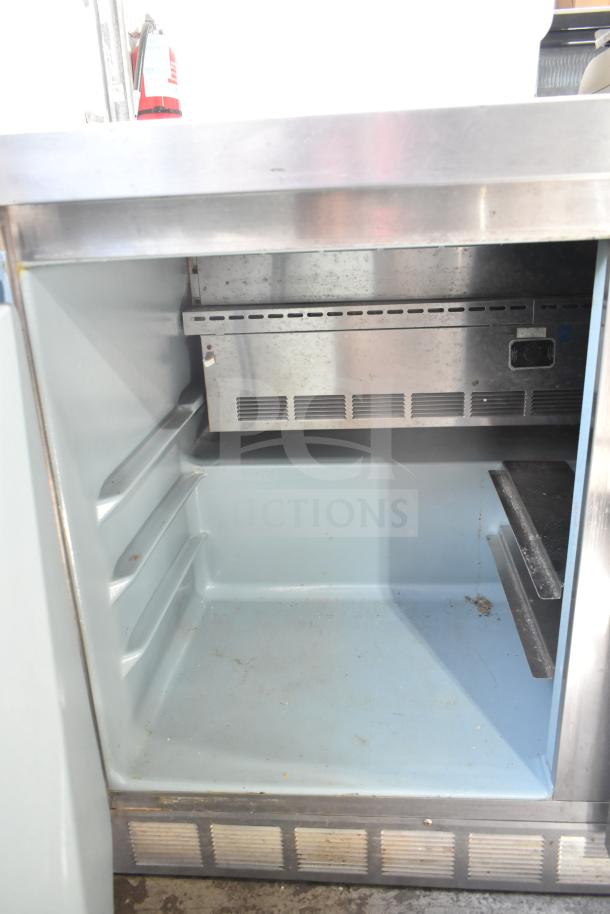 Delfield 4448 Commercial Undercounter Cooler, 2-door, 115V, 1 phase, stainless steel, some wear visible.