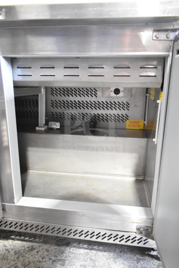 Edesa EDST-48-12 commercial sandwich salad prep table. Features stainless steel interior, visible control knobs, and vented panels.