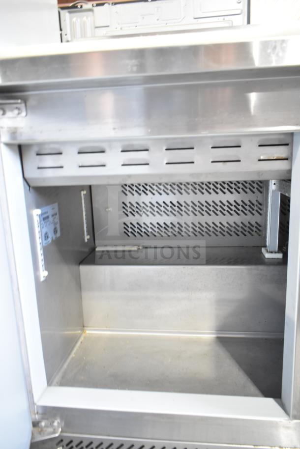 Edesa EDST-48-12 sandwich salad prep table. Stainless steel interior, Edesa label, well-maintained condition. 115V, 1 phase.