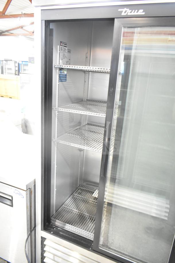 2019 True TSD-33G-HC-LD reach-in cooler, 2 doors, 115 volts, clean interior, visible True branding, commercial-grade.
