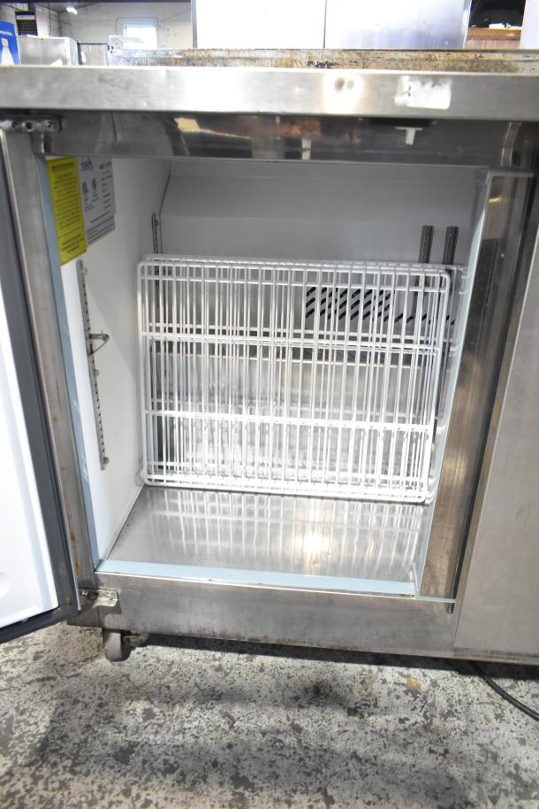 Yukon YUC-72F commercial 3-door undercounter freezer, stainless steel, 115V, 1 Phase, interior shelving visible, good condition.