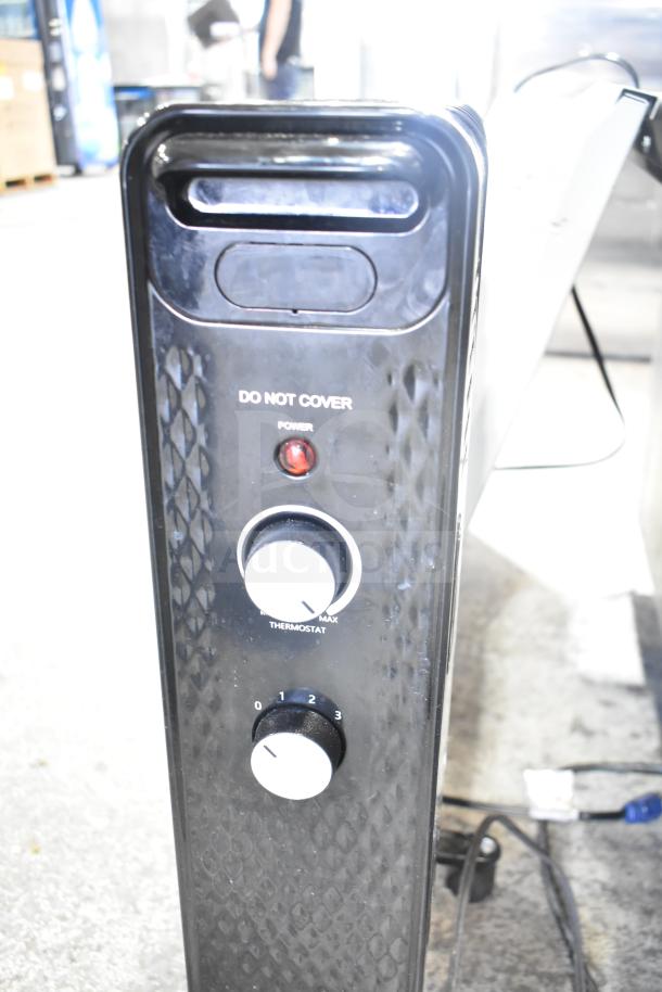 Air King 9166G fan and MainStays WSH07O2ABB heater; both in used condition. Heater features visible controls.