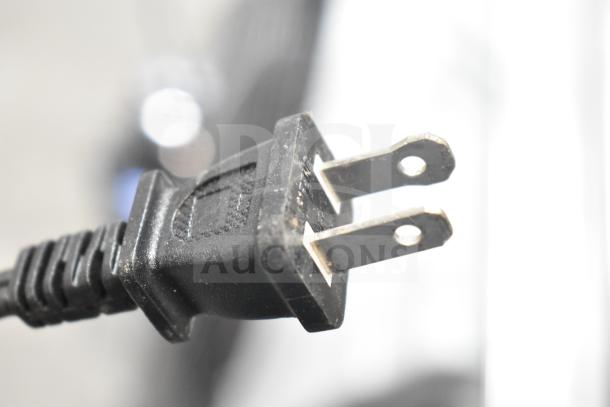 Close-up image of a standard two-prong electrical plug.